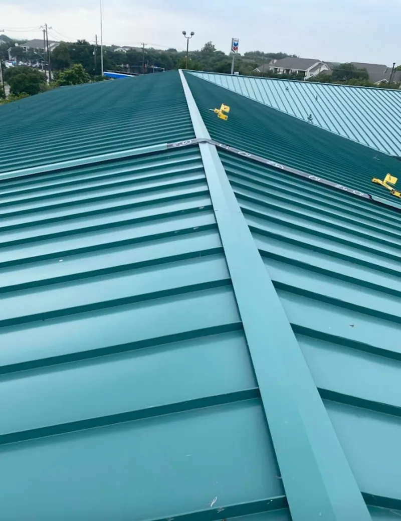 Green commercial metal roof ridge and valley for Metal Roof Repair in Fairview